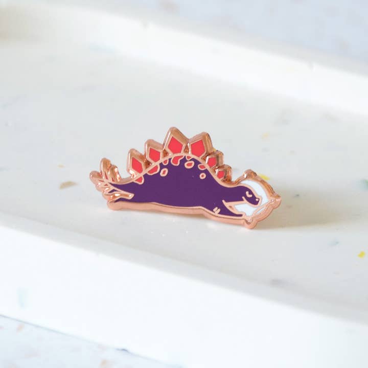 Stegasaurus Dinosaur Napping Enamel Pin for wholesale by Hop & Flop