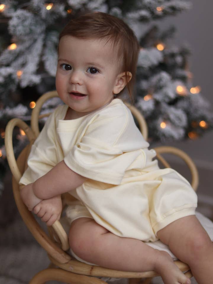 T-Shirt Romper for Babies in Vanilla for wholesale by Winnie + Crew