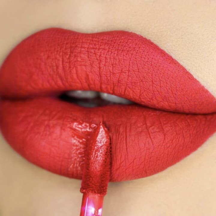 Poison Heart Cherry Red Liquid Silky Matte Lipstick for wholesale by Atomic Makeup