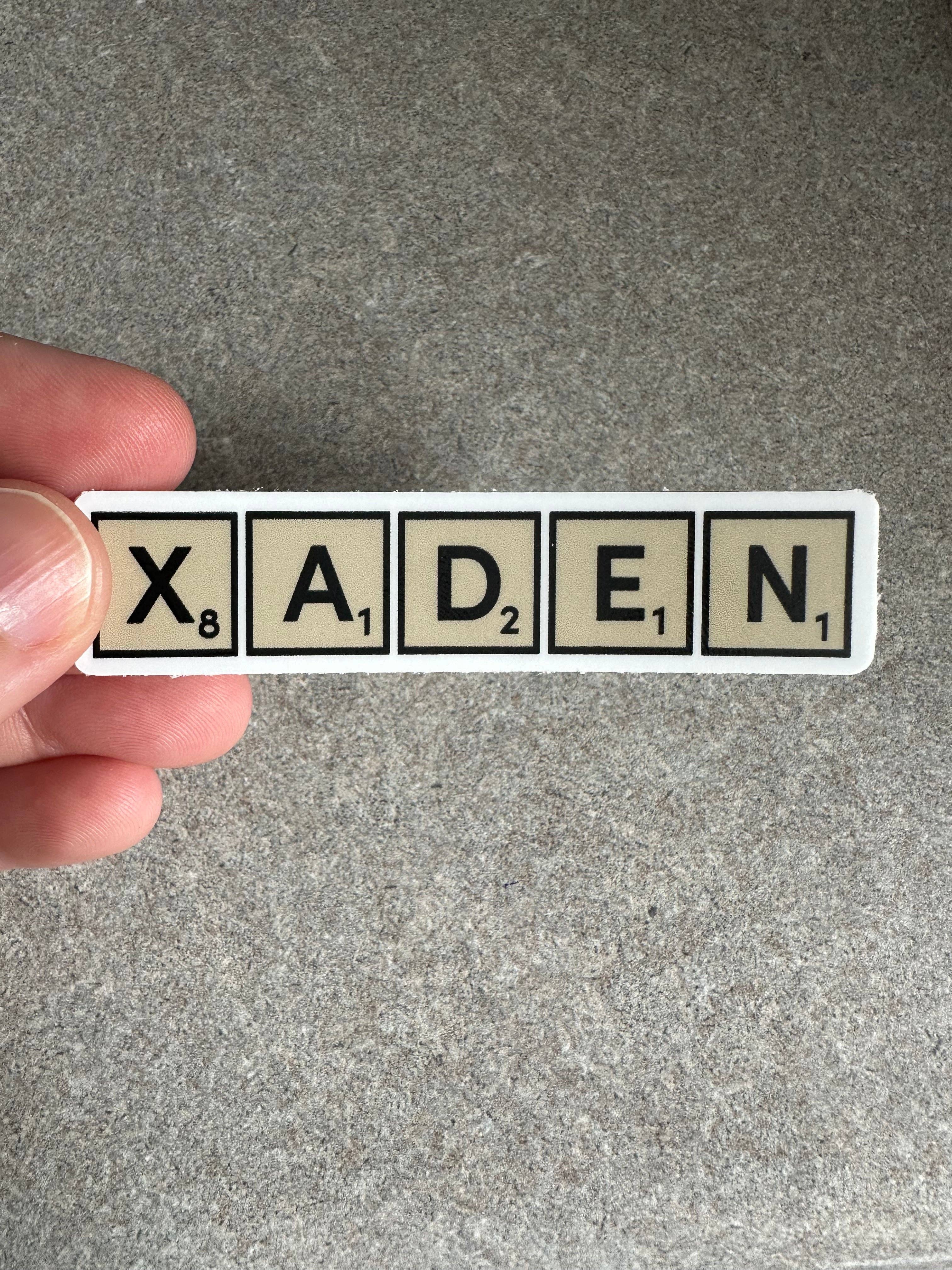 Merry May - Wholesale Sticker - Xaden Game Tiles Vinyl Sticker, 3.0” x 0.68”2