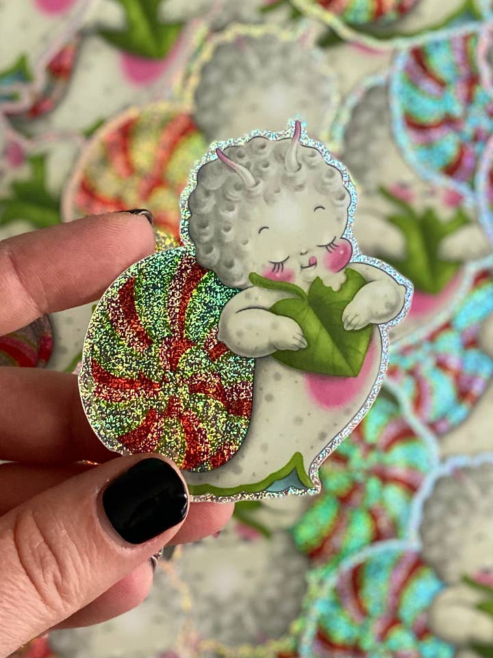 Lolli the Sparkly Snacking Snail Kewpie Sticker by Stacey Ma for wholesale by Stacey Martin Tattoos