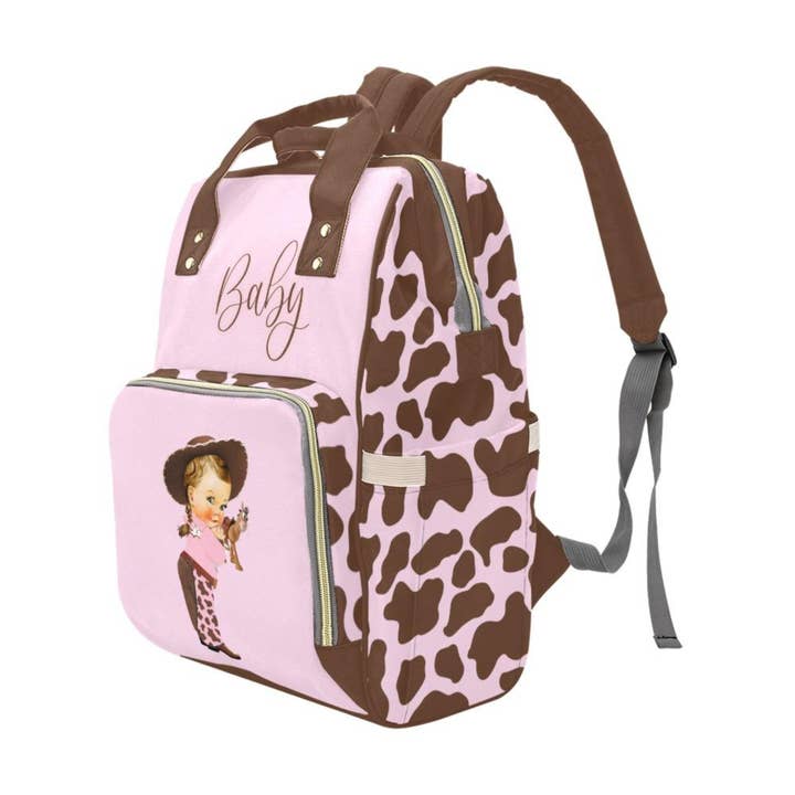 TJtoddles.com - Wholesale Diaper Bag - Baby - Designer Diaper Bags - Cute Cowgirl With Brown Cow Print On Soft Pink Waterproof Diaper Bag