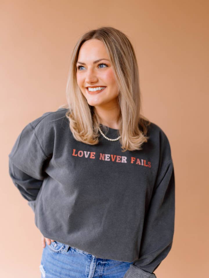 LOVE NEVER FAILS Charcoal Pullover for wholesale by Set Apart Apparel