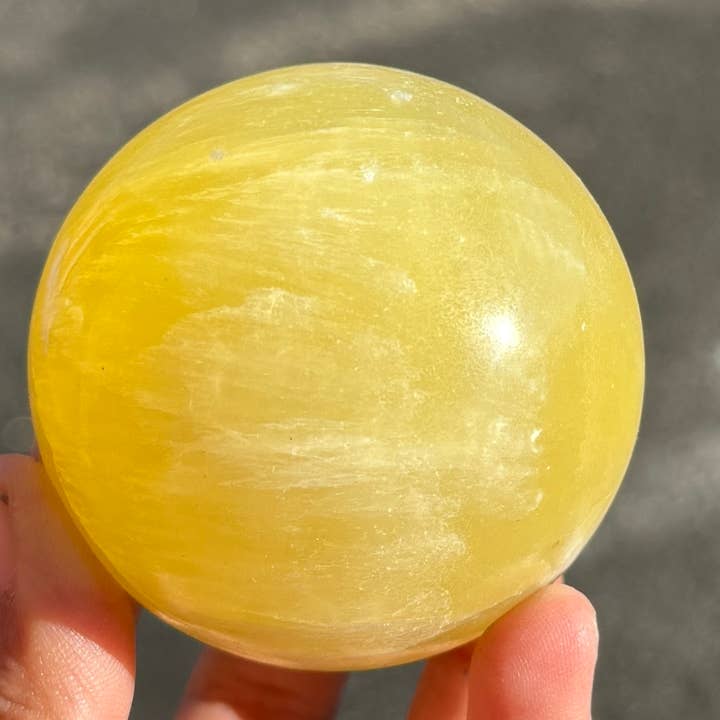 LEMON CALCITE SPHERES BIG (60MM - 65MM) for wholesale by Metaphysical & Healing Crystals