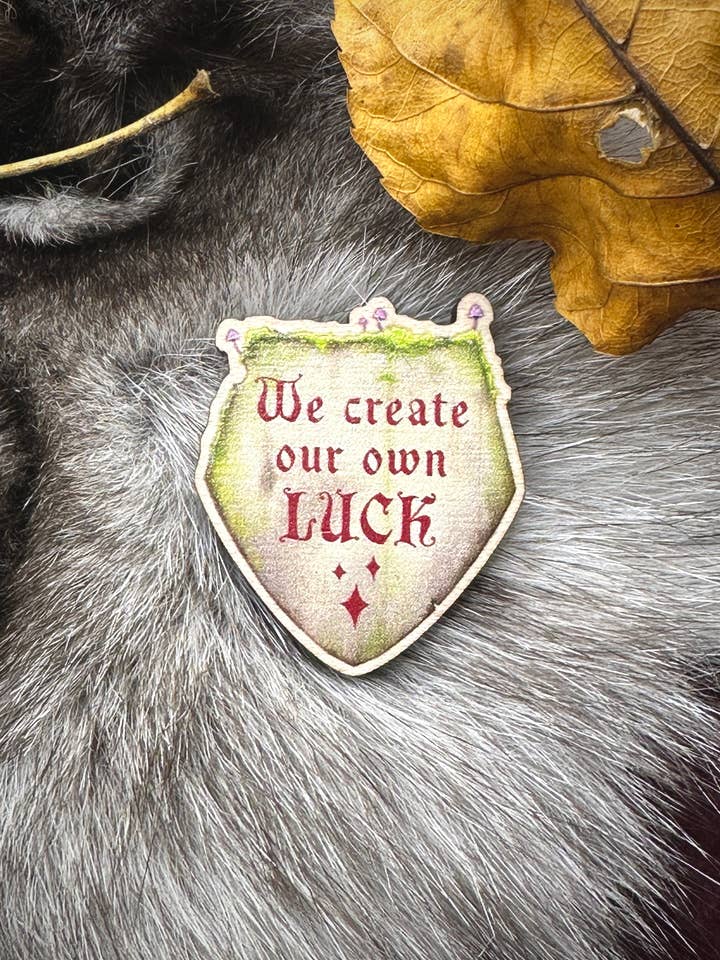 We Create Our Own Luck Wooden Pin for wholesale by Katelyn Gagnon Art