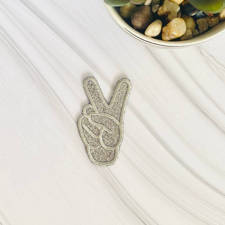 Glitter peace sign hand embroidered hat patch for wholesale by R & R Stitched