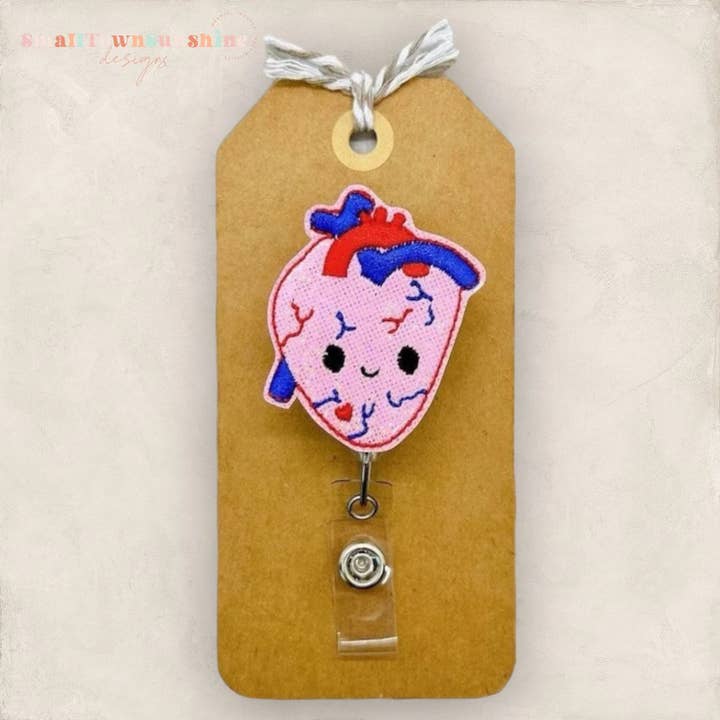 Anatomically Correct Heart with Face Badge Reel for wholesale by The SmallTownSunshine Company