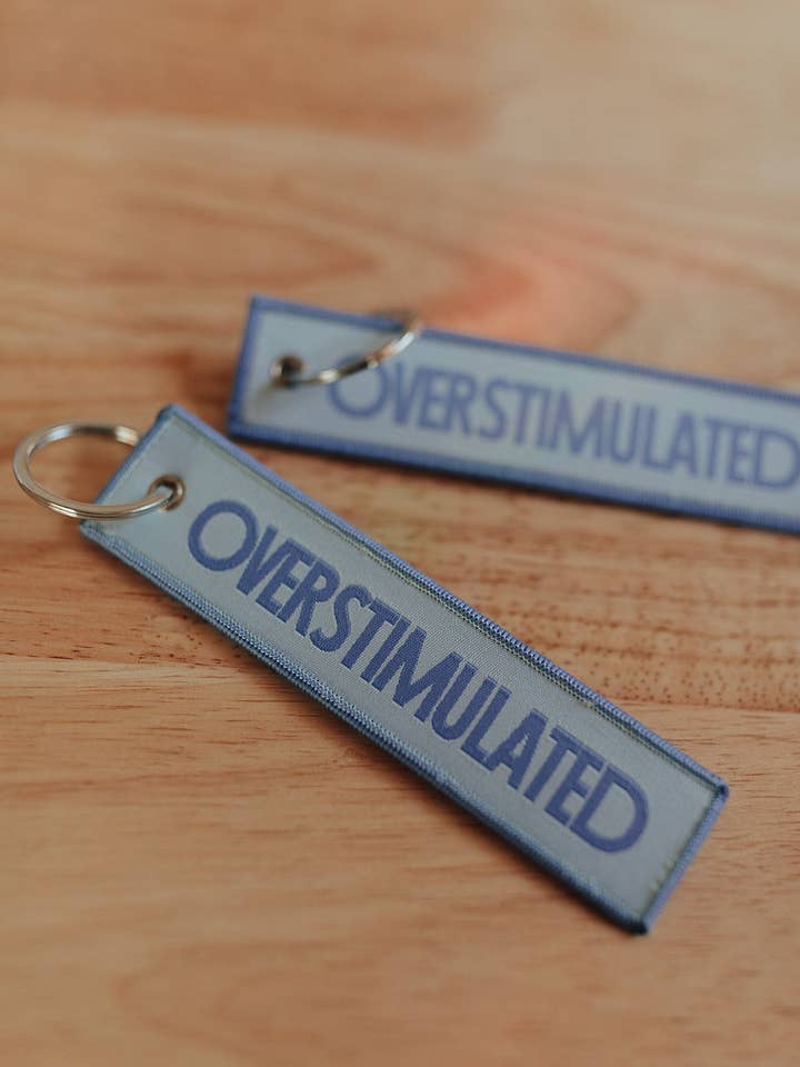 Overstimulated Embroidered Keychain for wholesale by kash co studio