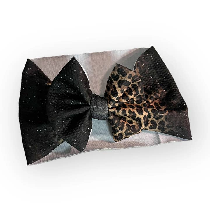 Fiocco per capelli con glitter neri e ghepardo per la vendita all'ingrosso da parte di Tiny toes Baby Co