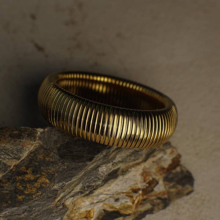 Ornelia Gold Coil Bangle Bracelet for wholesale by Faya & Co.