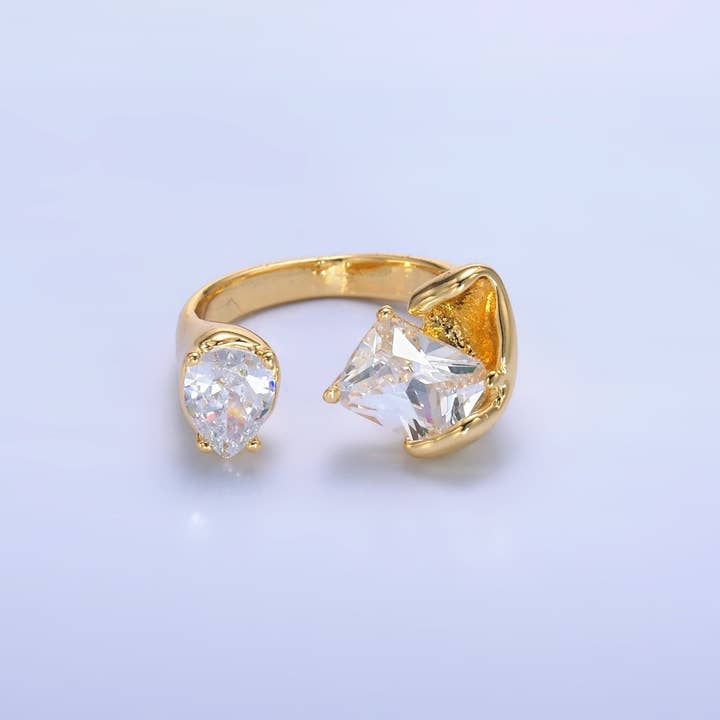 Ouro Anel de Garra Envolvente Fundida com Baguete de Zircônia Cúbica Transparente Revestido a Ouro 24K | O844 para venda a revendedores na Faire