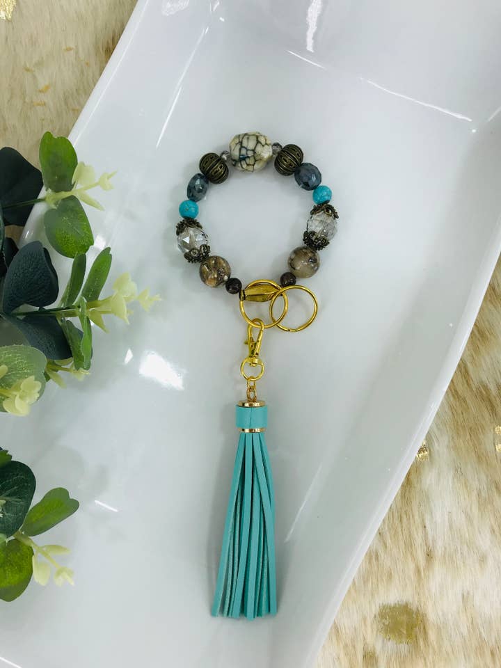 Glass Bead and Faux Leather Tassel Keychain Bracelet for wholesale by Magnolia & Peach Jewelry Boutique, LLC