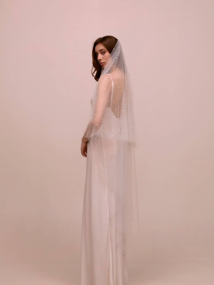 Dauwdruppel voor wholesale door Heirloom Bridal Company