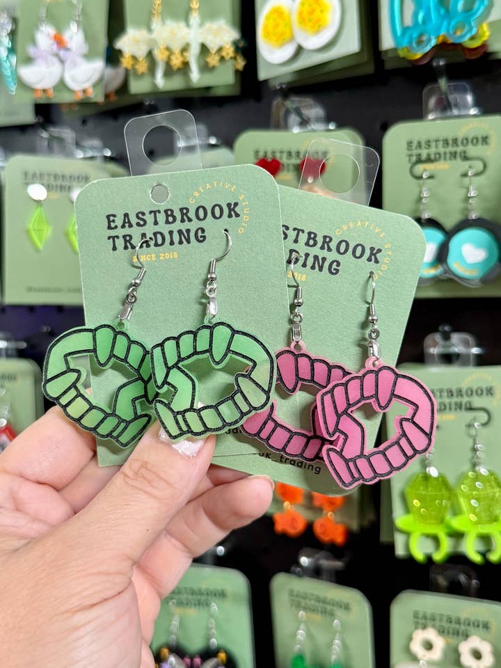 Glow in the dark Fang earrings for wholesale by Eastbrook Trading