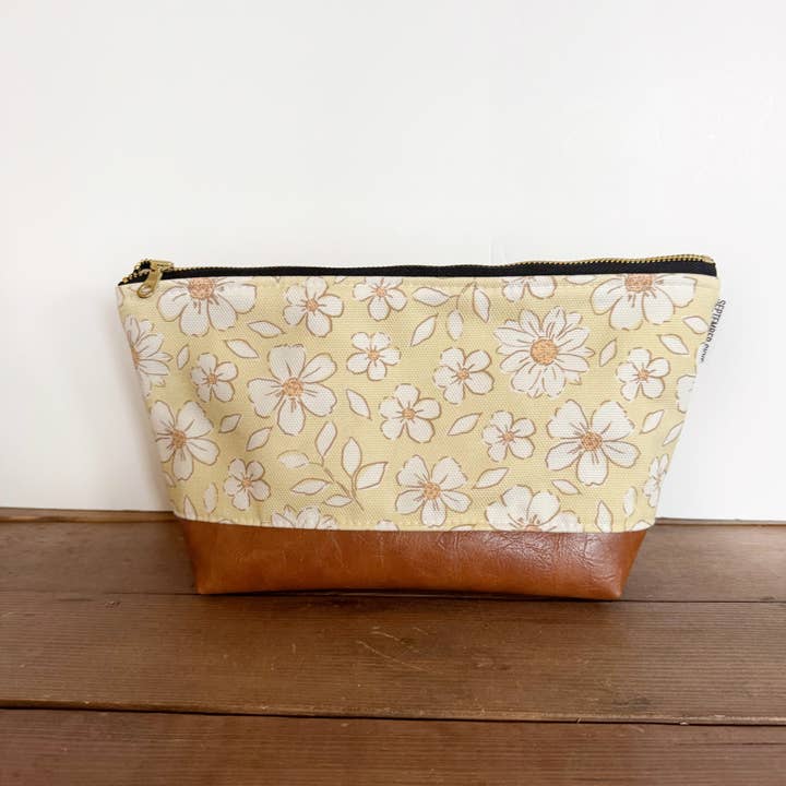 Makeup bag in sketchy yellow floral daisy for wholesale by September Skye Bags & Accessories
