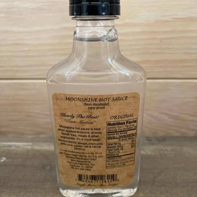 Fairhope Favorites, Inc. - Wholesale Pikante saus - Catch & Release My Ass Moonshine Hot Sauce Label - Origineel1