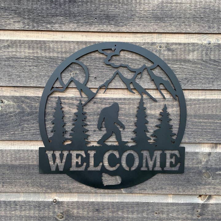 Bigfoot Welcome Sign - Mountain Scene, Trees, Paw Print Wall Art for wholesale by Rebel Metal Gifts & Decor