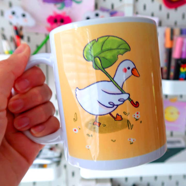Tasse Canard avec Parapluie Feuille pour la vente par Pollygone Illustration