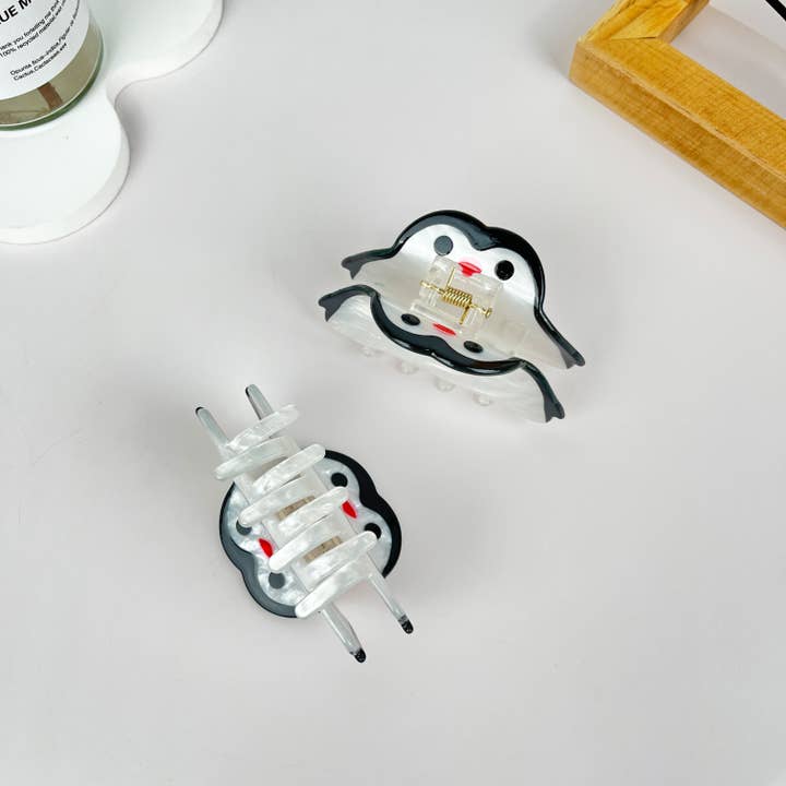White Acrylic penguin animal hair claw clip for wholesale on Faire2