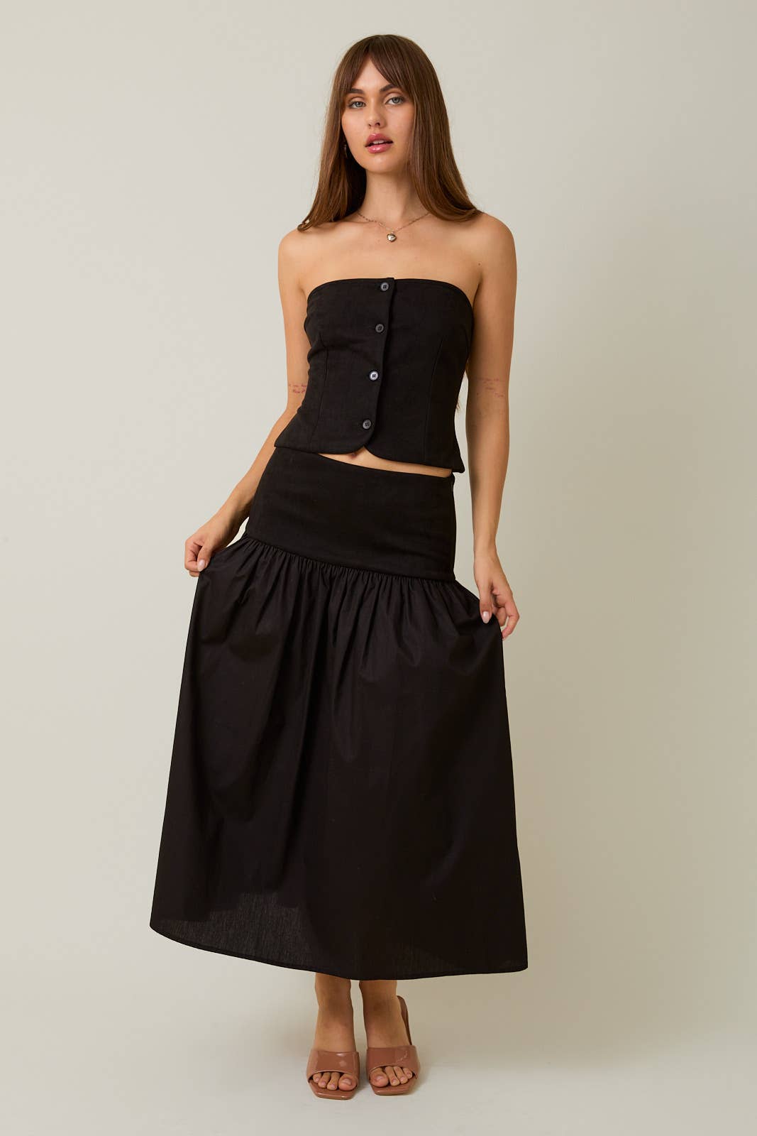 Black STRAPLESS SMOCKED BACK SUEDE TUBE TOP & CONTRAST MIDI SKIRT for wholesale on Faire