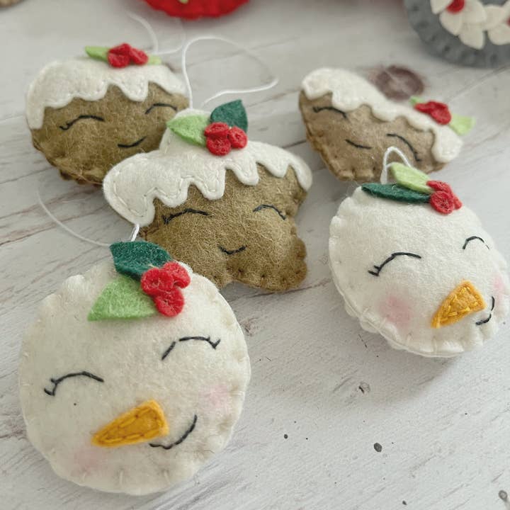 Felt snowman ornament with leaves, smiling snowman for wholesale by Grab a Coffee