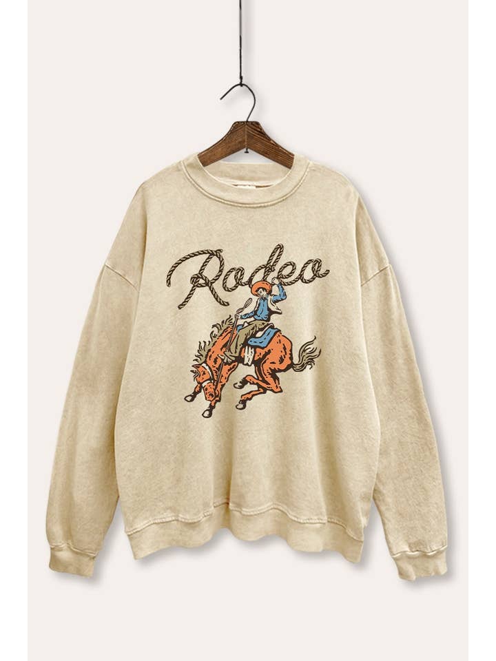 FELPA GRAFICA LAVATA MINERALE CON LASSO DA COWBOY RODEO per la vendita all'ingrosso da parte di PINK NABI