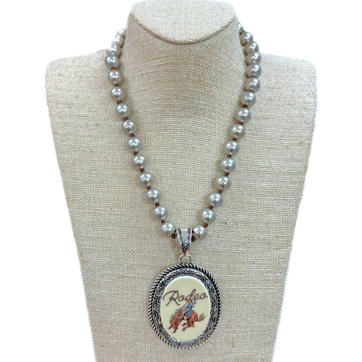 Vintage Rodeo Pendant with Etched & Rope Edge on Faux Navajo for wholesale by Accessories To Go