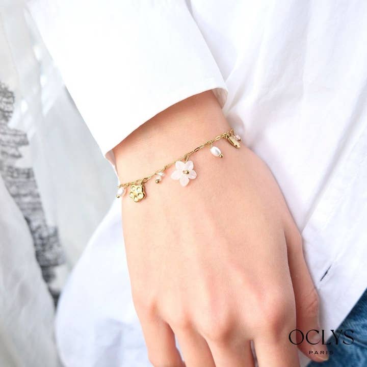 Swallow flower charm bracelet in gold stainless steel for wholesale by Oclys