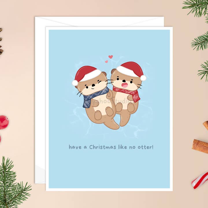 Weihnachtskarte „Have a Christmas Like No Otter“ für den Großhandel von Raychoo Studios Inc.