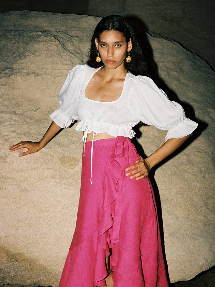 La gonna a portafoglio in lino Catalina in rosa acceso per la vendita all'ingrosso da parte di arkitaip