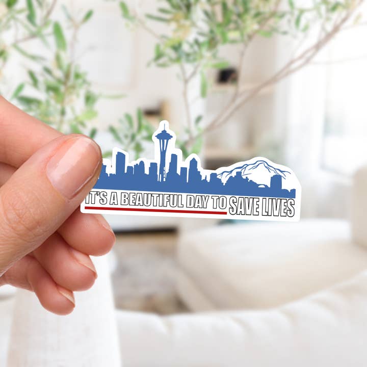 Saving Lives in Seattle Sticker for wholesale by Couch McDoodles