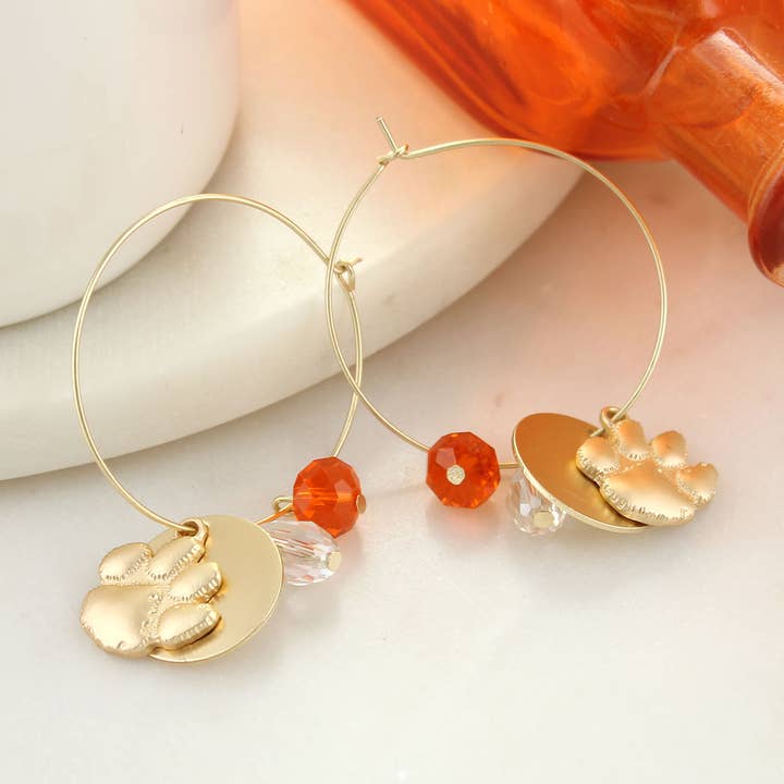 Créoles Clemson avec logo en or mat pour la vente par Seasons Jewelry