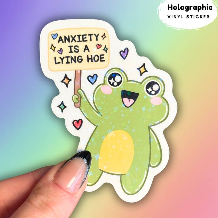 Anxiety is a lying hoe frog holographic sticker for wholesale by Crafty Baker Designs