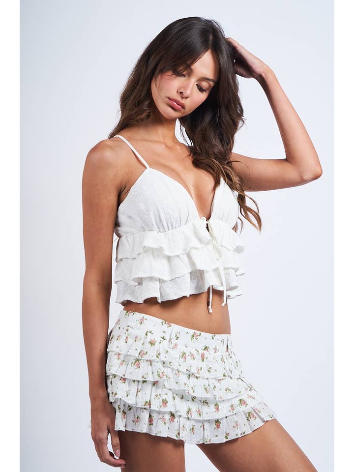 OEILLET BLANC CROP TOP À VOLANTS SANS MANCHES BLANC À OEILLETS EN FORME DE CŒUR en vente sur Faire7