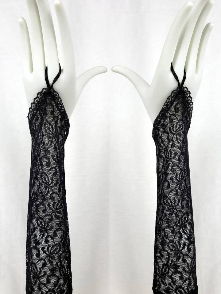 Par fingerlösa spetshandskar G2168BL för wholesale av Chicas