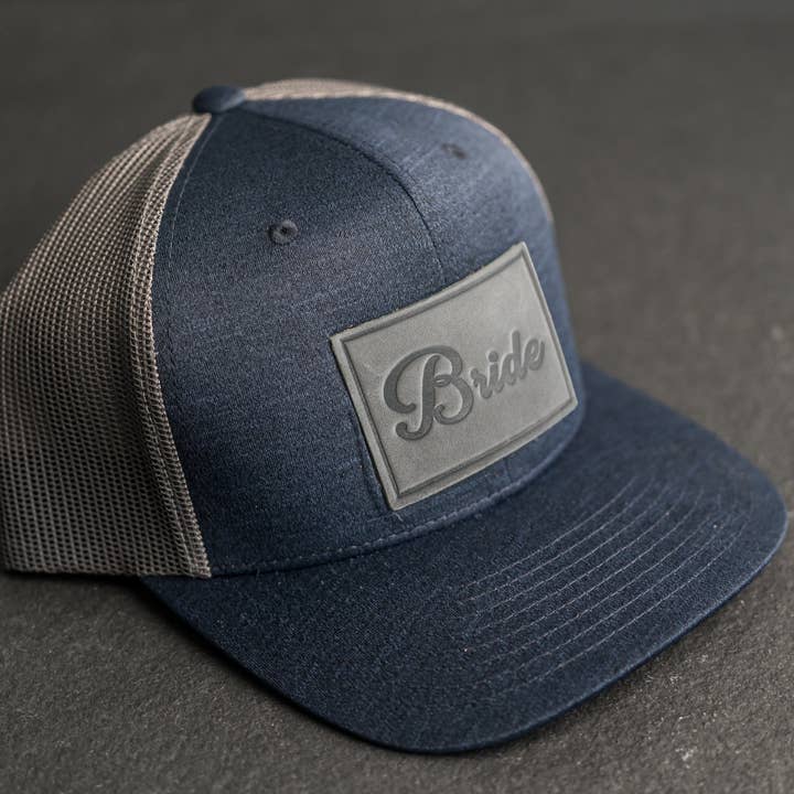 Leather Patch Performance Style Trucker Hat - Bride and Groom Stamp (cursive) for wholesale by Ox & Pine