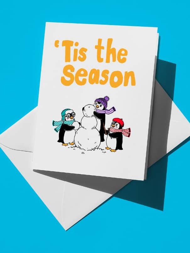 Tis the Season Winter Holiday Card Penguins Building a Snowman | A2 5.5"x4.25" Blank Greeting Card with Envelopes | Premium Matte Cardstock for wholesale by semiserious studio