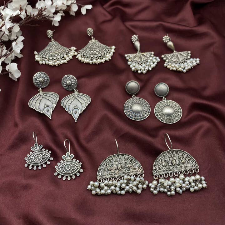Quirky Fashions - Wholesale Jewelry Set - Silver Jhumka, Evil Eye, Peacock & Pearl Earrings Set1