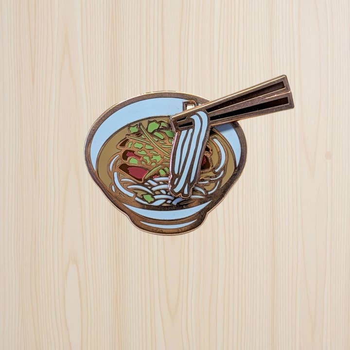 Pho Interactive Sliding Enamel Pin for wholesale by Noms
