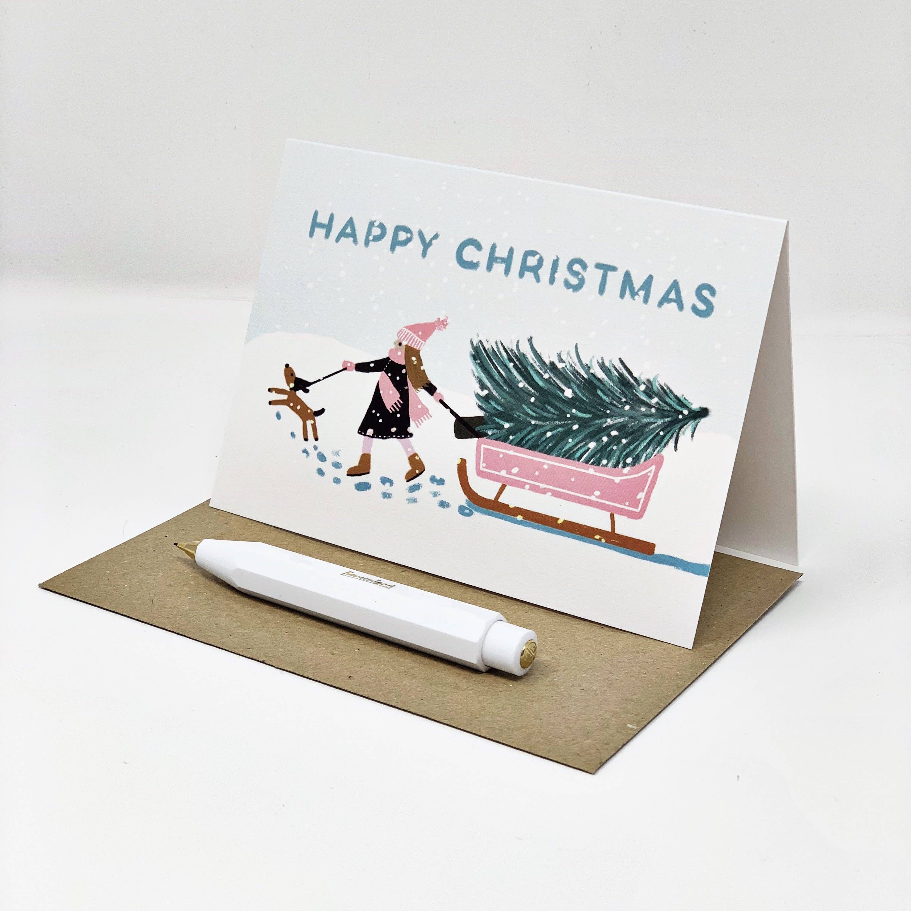Lomond Paper Co – wholesale Christmas card – Girl with Pink Sledge - Happy Christmas2