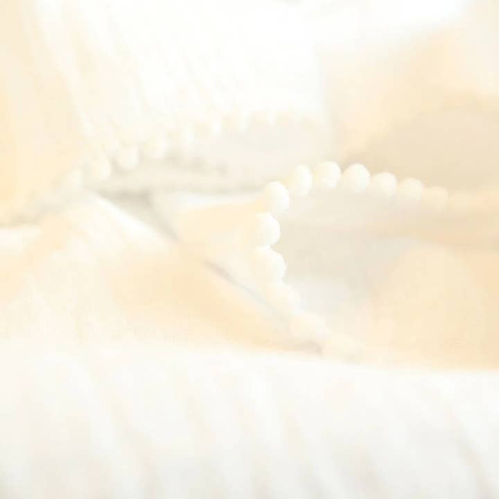 Au Petit Coton - Venta al por mayor Manta de cama - Niños y bebés - Gorrito de algodón orgánico LUMI con pompones para bebé1