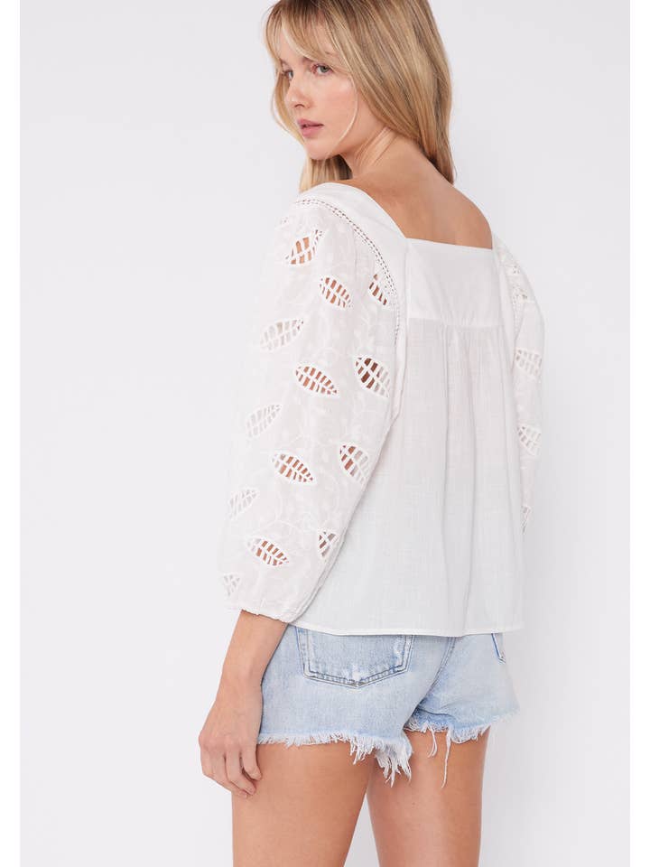 White Embroidered Cutout 3/4 Sleeve Tie Neck Blouse for wholesale on Faire
