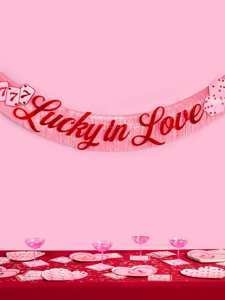 Lucky in Love Fringe Banner | Pink, Red Foil, Bachelorette for wholesale by xo, Fetti