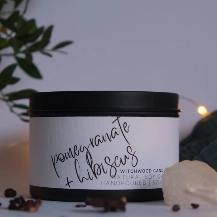 Pomegranate and Hibiscus scented soy candle, matte black tin for wholesale by Witchwood Candles