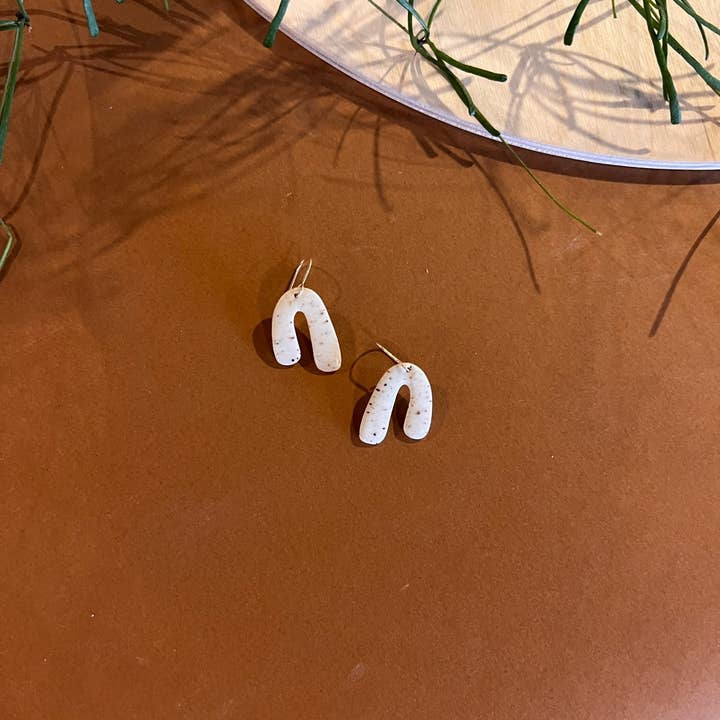 Small Asymmetrical Arch Dangle Earring for wholesale by Klei Ceramics