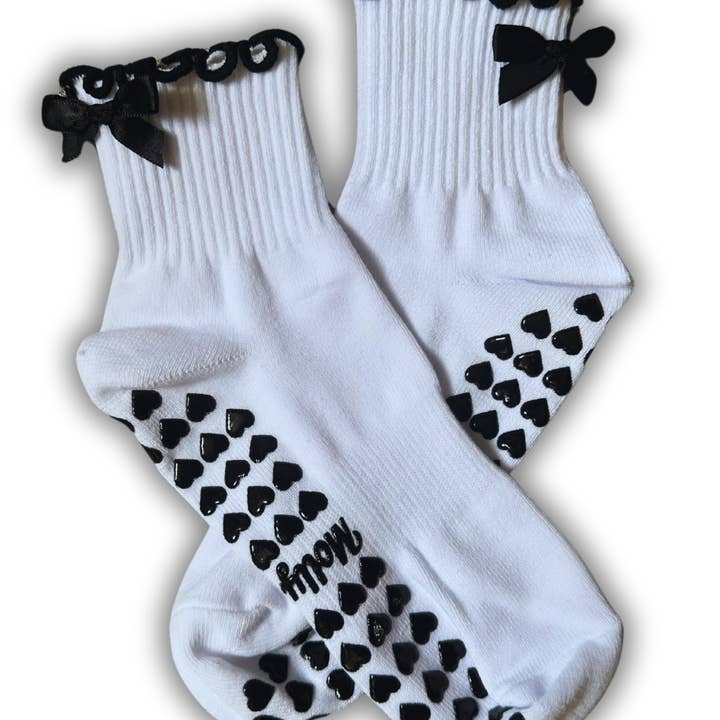 Black & White bow grip sock with heart grips for wholesale by MollyGraceGripSocks
