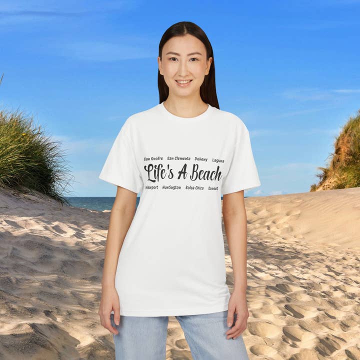 Unisex Sueded Graphic Tee – Life’s A Beach – Coastal Design Cotton Shirt for wholesale by Restored By Nature Company
