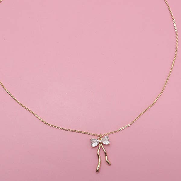 Gold PETITE RHINESTONE BOW NECKLACE | 80N600 for wholesale on Faire
