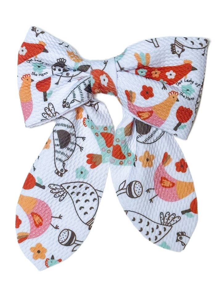 Vor Frue af Hønens Klipsløjfe for engroshandel hos Caelesti Co.