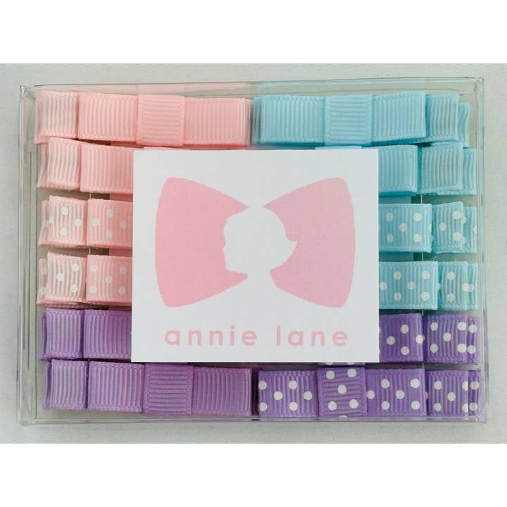 Låda med 12 hårrosetter - rosa/blå/lavendel par för wholesale av Annie Lane